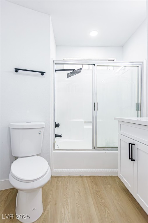 661 Riata Way Las Vegas, NV 89110 - Photo 13 of 30 Full bath featuring vanity, combined bath / shower with glass door, and light wood-style floors