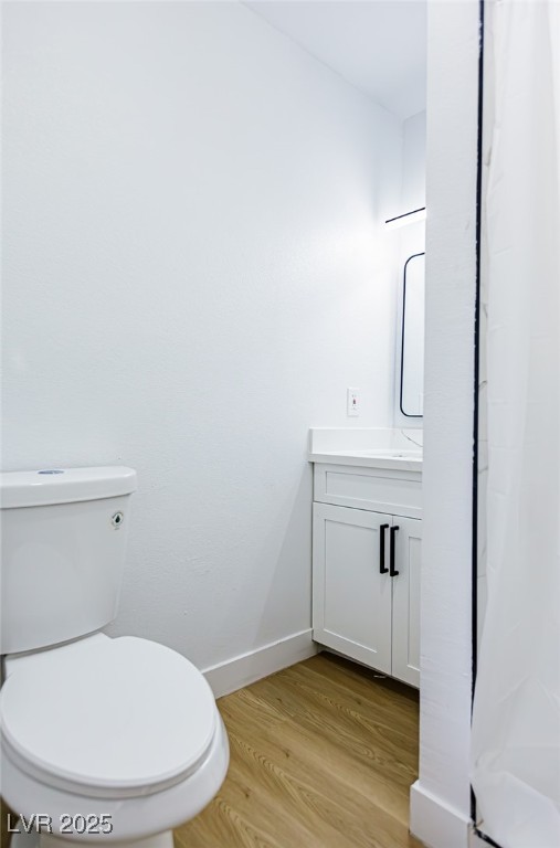 661 Riata Way Las Vegas, NV 89110 - Photo 25 of 30 Bathroom featuring vanity, a shower with shower curtain, and light wood-style floors