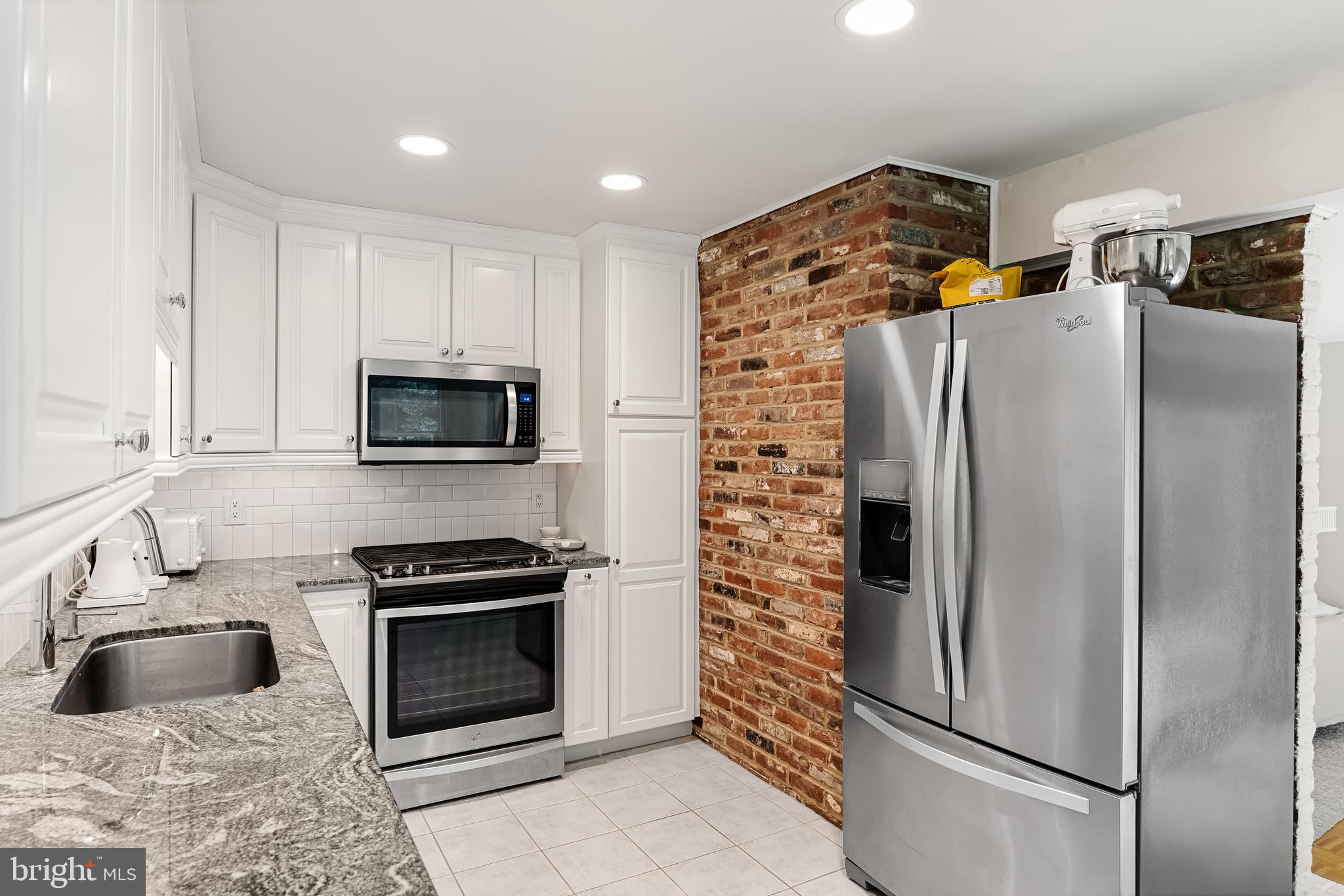 118 Barcroft Drive Cherry Hill, NJ 08034 - Photo 25 of 75 a kitchen with stainless steel appliances granite countertop a refrigerator stove and microwave