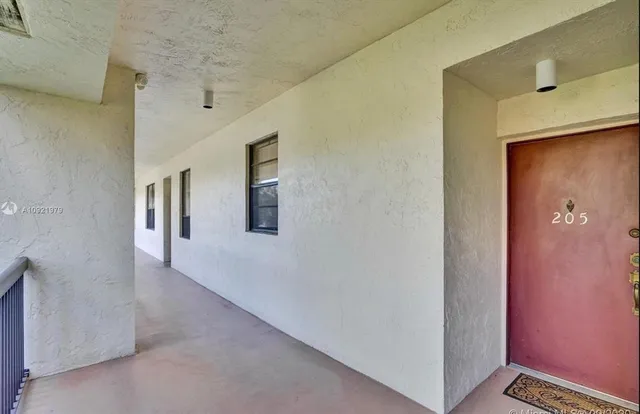 a view of a hallway with entryway