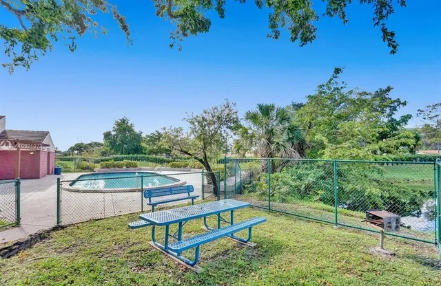 a view of a park with large trees
