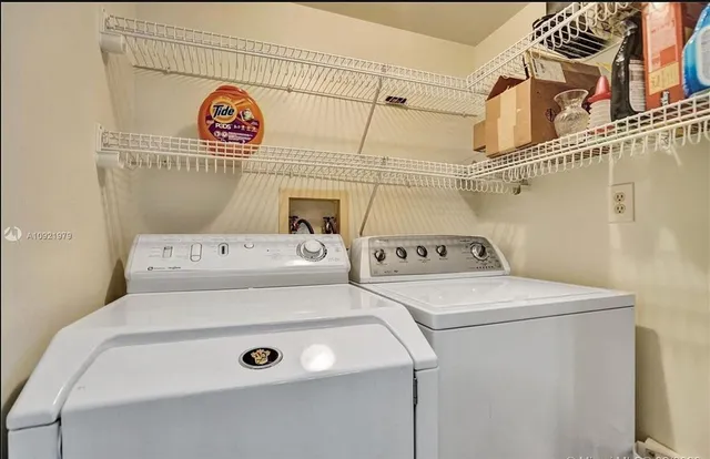 a utility room with dryer and washer
