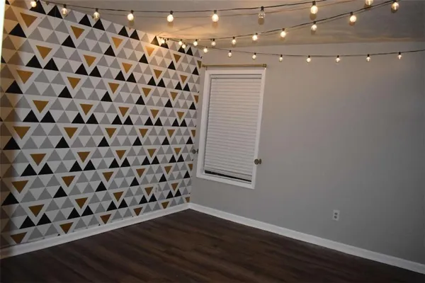 a view of a livingroom with wooden floor