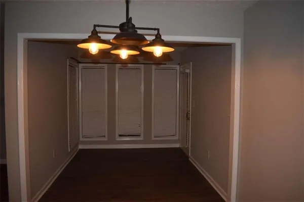 a view of room with chandelier fan