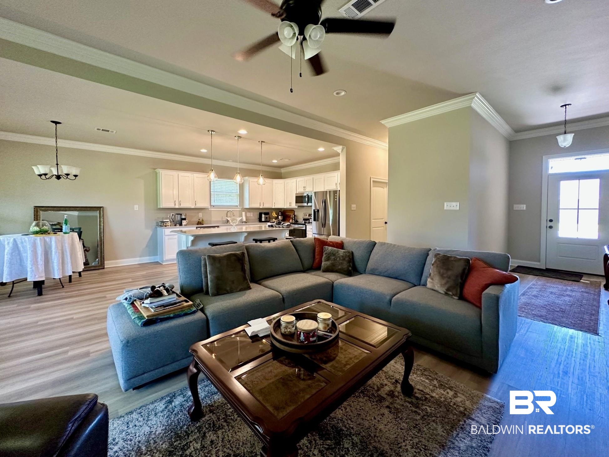 1009 Ruisseau Drive Foley, AL 36535 - Photo 20 of 55 Living room featuring light hardwood / wood-style floors, crown molding, and ceiling fan with notable chandelier