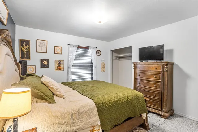 a bedroom with a bed and furniture