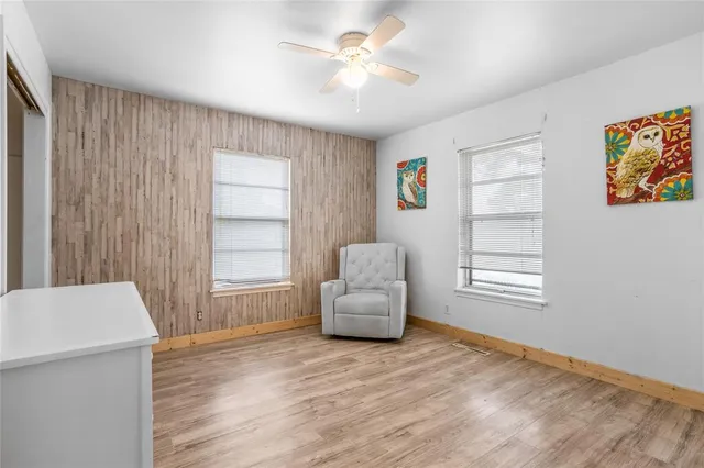 a bedroom with furniture and a window