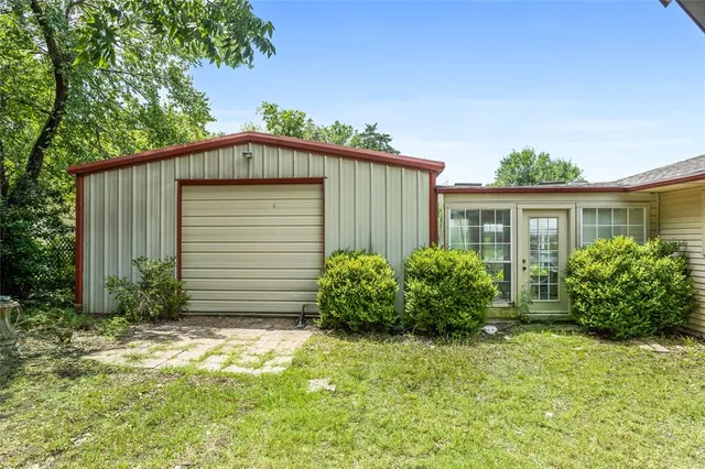 a view of a house with a garden