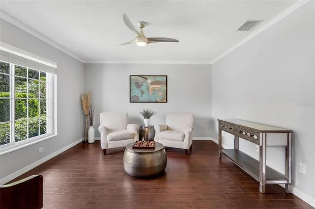 a living room with furniture and a window