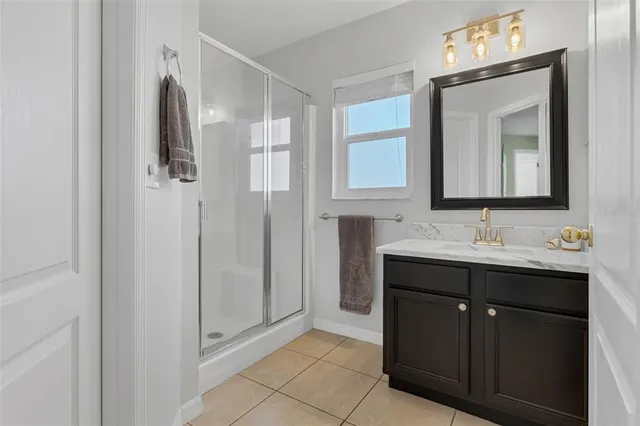 a bathroom with a double vanity sink and mirror