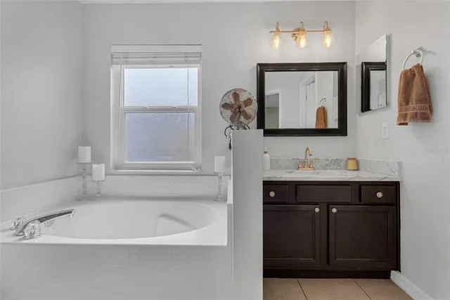 a bathroom with a sink a vanity and a mirror