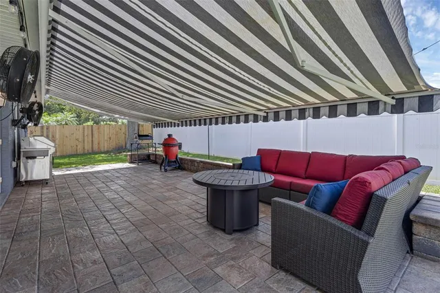a outdoor living space with furniture and a fireplace