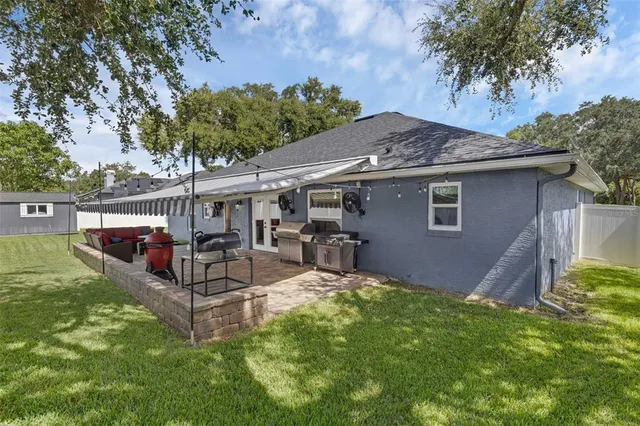 a view of a house with a yard porch and sitting area