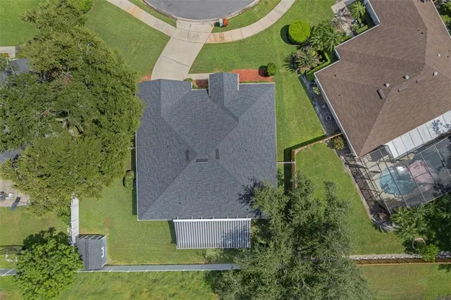 an aerial view of a house with outdoor space