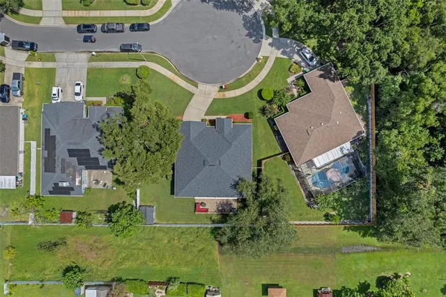 an aerial view of residential house with outdoor space and swimming pool