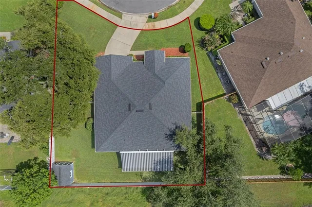 an aerial view of residential house with outdoor space and swimming pool
