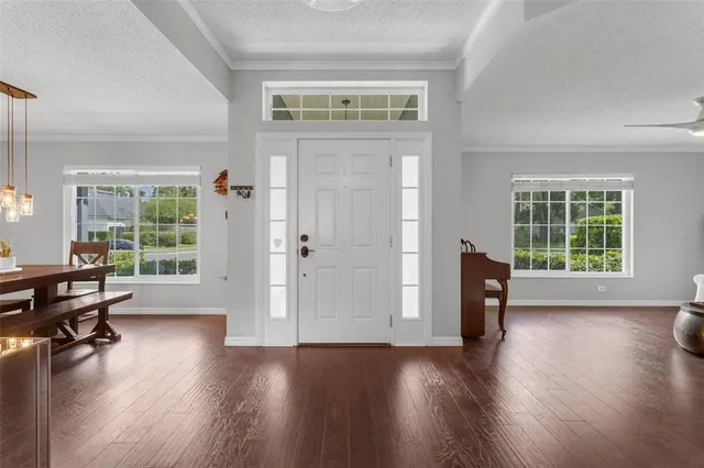 a view of a livingroom with furniture and a window