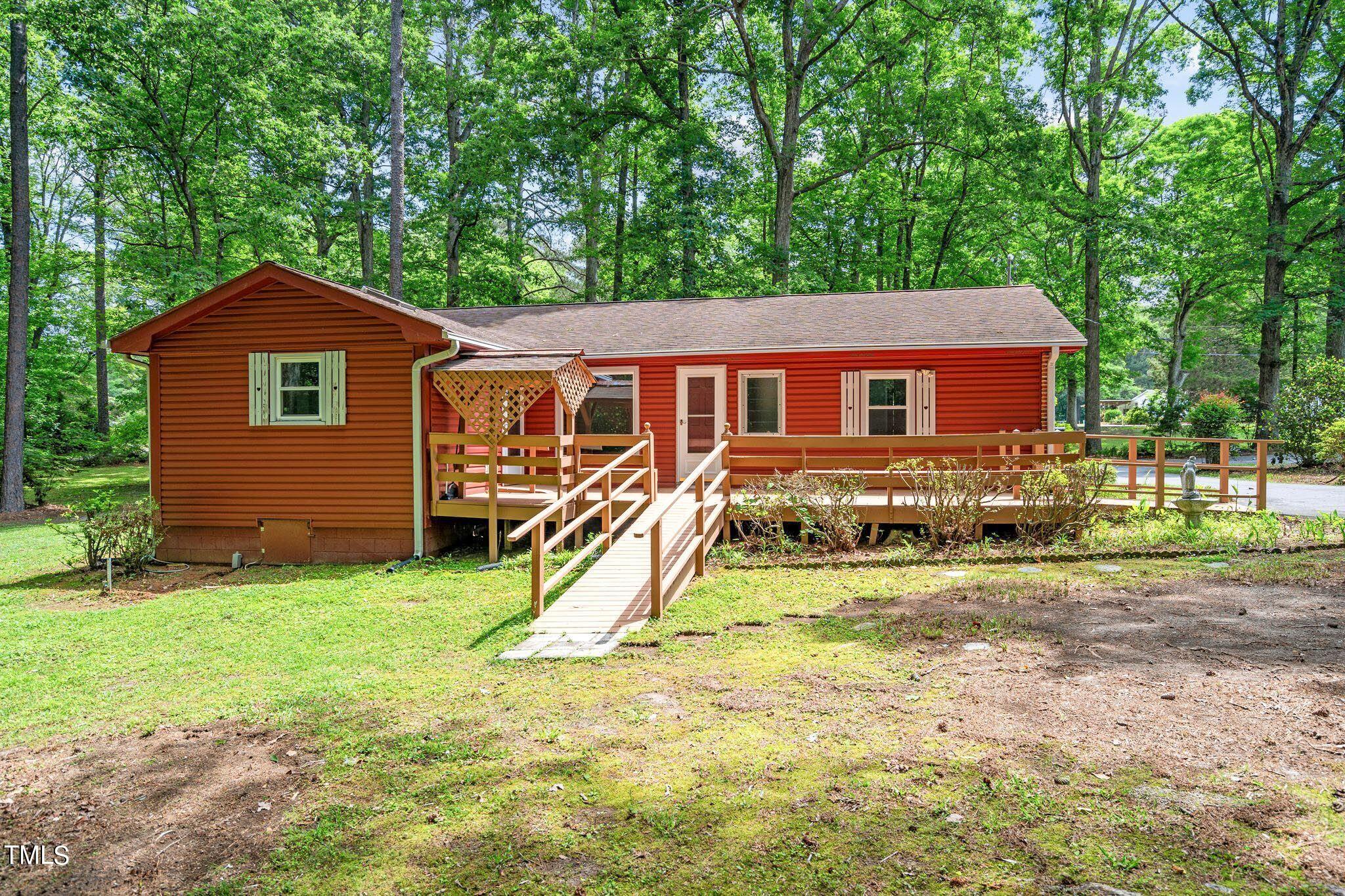 8200 Middleton Road Garner, NC 27529 - Photo 4 of 60 a view of a house with a yard