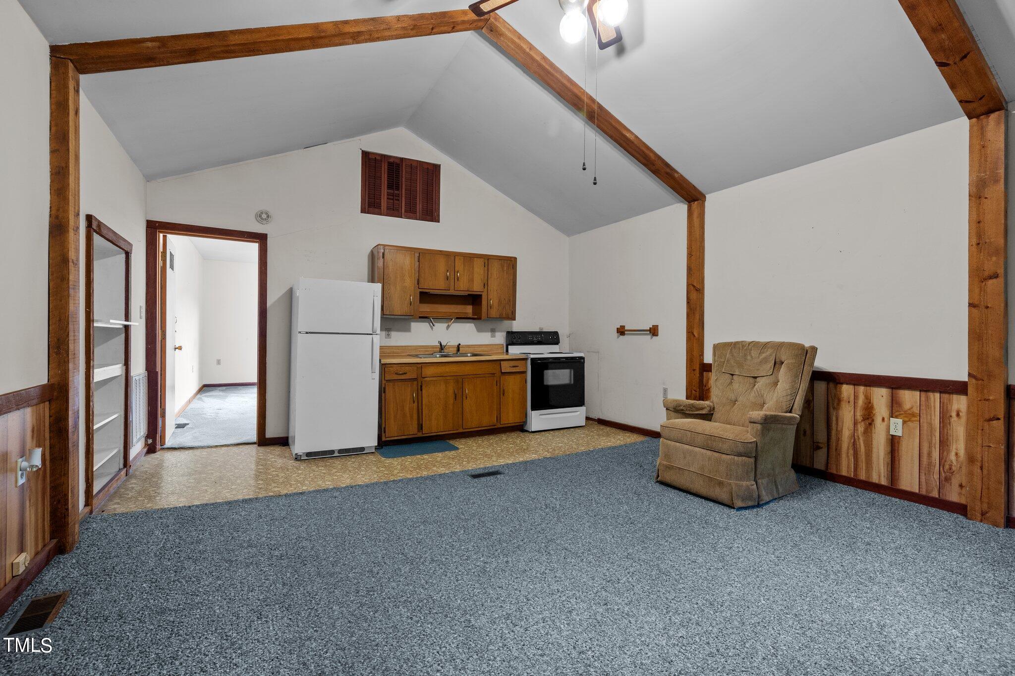 8200 Middleton Road Garner, NC 27529 - Photo 41 of 60 a living room with furniture and a flat screen tv