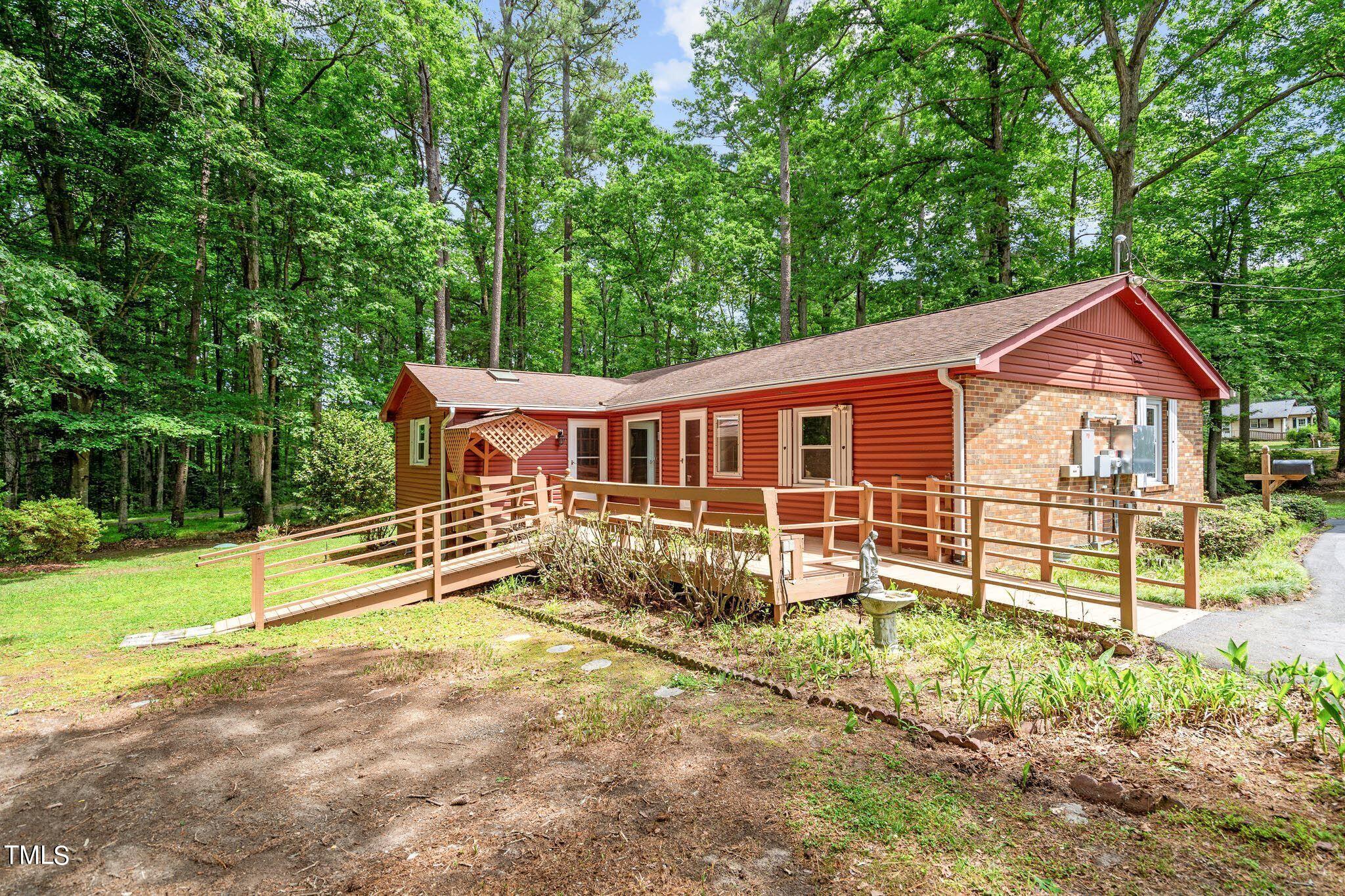 8200 Middleton Road Garner, NC 27529 - Photo 44 of 60 a view of a house with backyard and trees