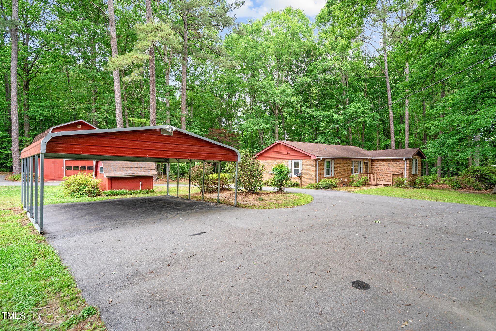 8200 Middleton Road Garner, NC 27529 - Photo 53 of 60 a view of a house with backyard and a area
