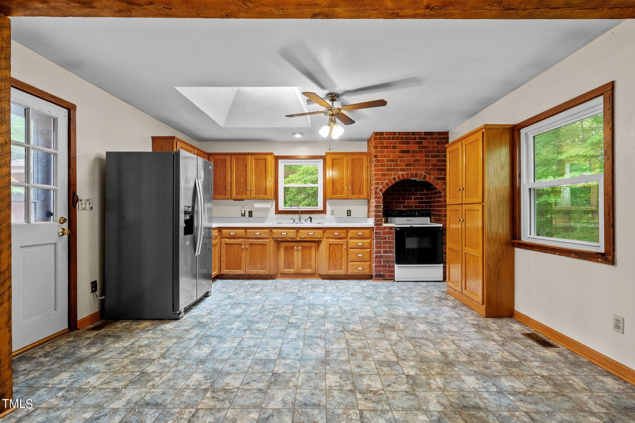 8200 Middleton Road Garner, NC 27529 - Photo 6 of 60 a kitchen with stainless steel appliances granite countertop a refrigerator a sink a stove and island