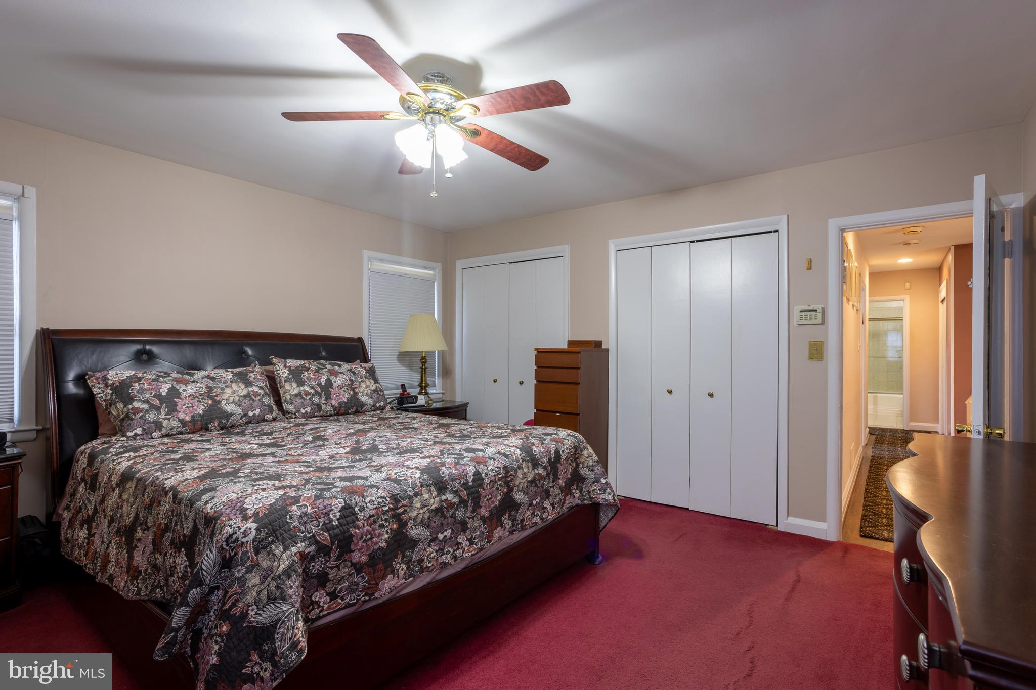 3215 Northbrook Road Baltimore, MD 21208 - Photo 21 of 50 a bedroom with a large bed and a chandelier