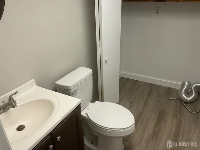 a white toilet sitting next to a bathroom sink