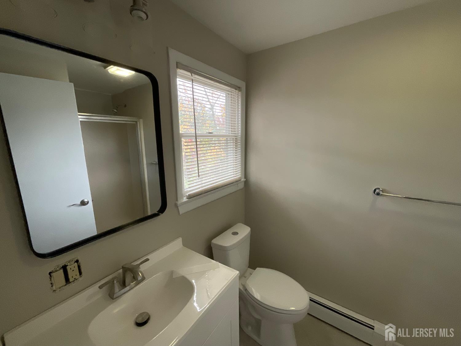 939 Englishtown Road Old Bridge, NJ 08857 - Photo 5 of 12 a bathroom with a sink and a toilet