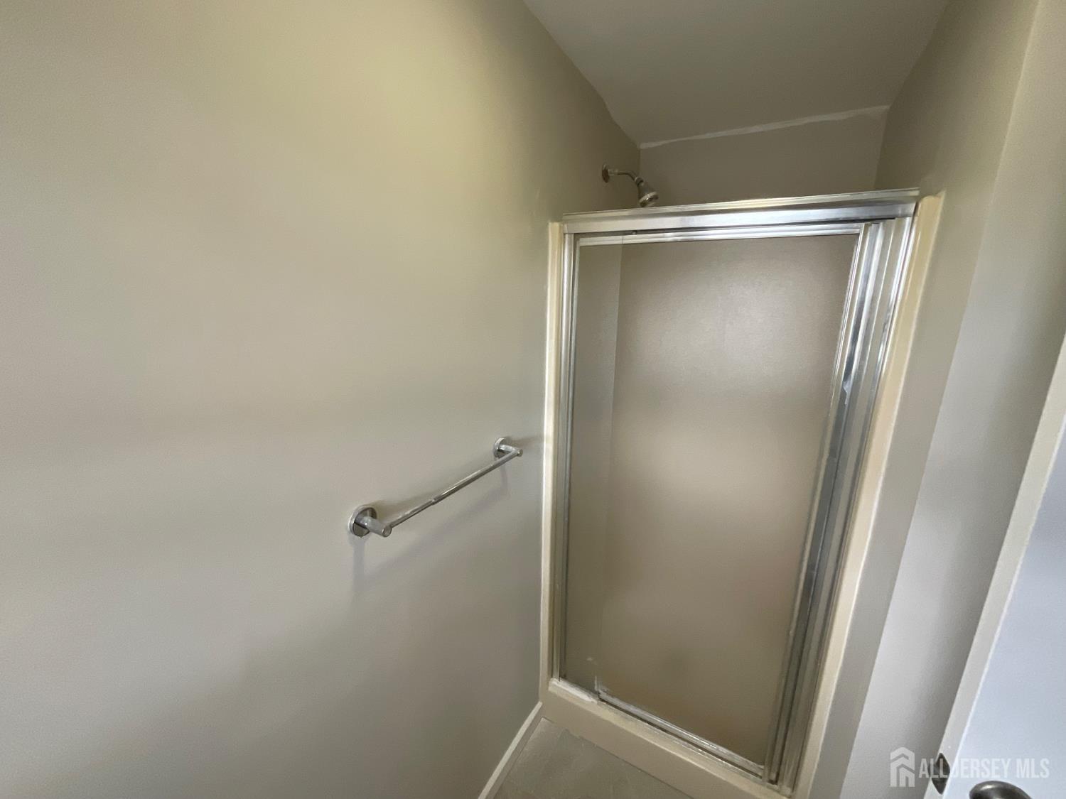 939 Englishtown Road Old Bridge, NJ 08857 - Photo 6 of 12 a bathroom with a glass shower door