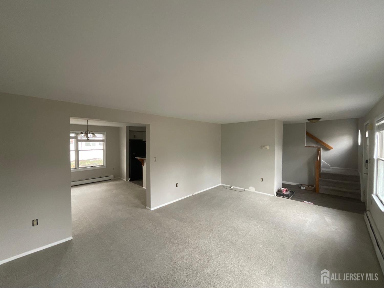 939 Englishtown Road Old Bridge, NJ 08857 - Photo 7 of 12 an empty room with a empty space and windows