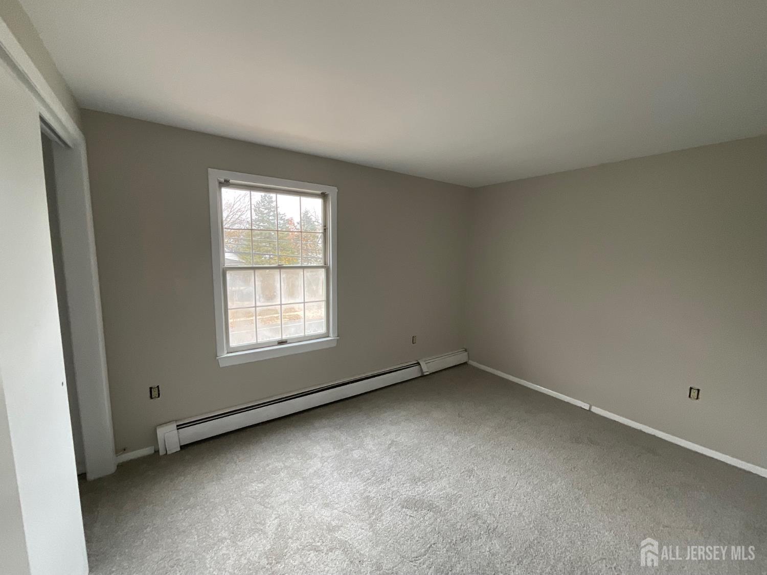 939 Englishtown Road Old Bridge, NJ 08857 - Photo 9 of 12 an empty room with a window
