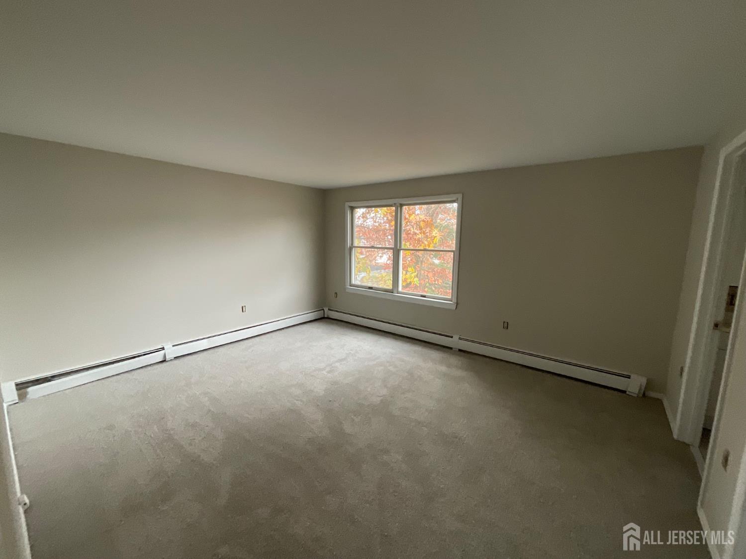 939 Englishtown Road Old Bridge, NJ 08857 - Photo 10 of 12 an empty room with windows