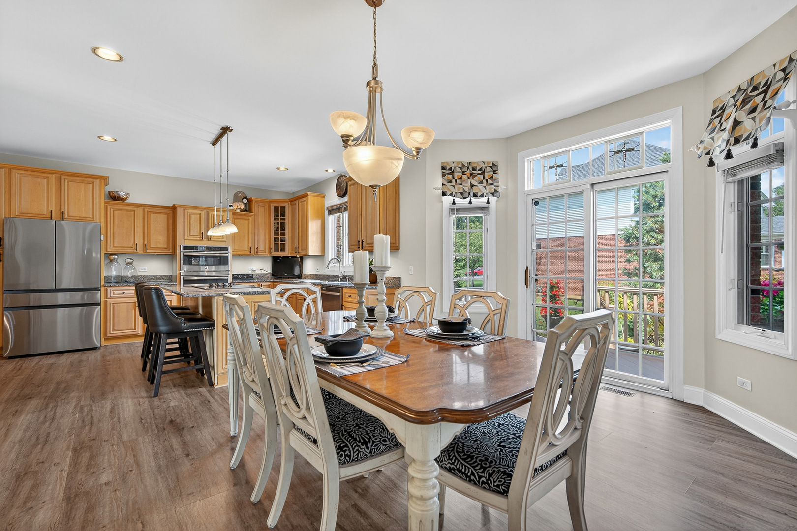 4210 Jacqueline Lane Crystal Lake, IL 60014 - Photo 14 of 48 a dining room with stainless steel appliances granite countertop a dining table and chairs
