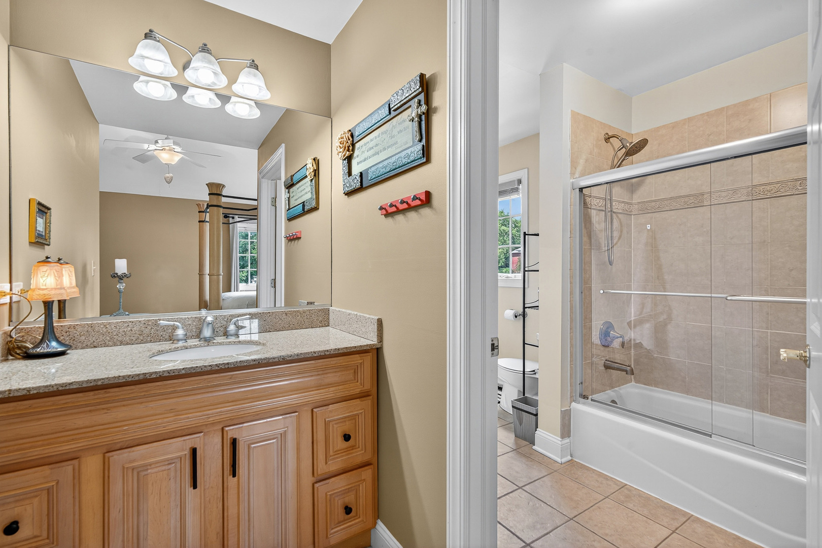 4210 Jacqueline Lane Crystal Lake, IL 60014 - Photo 22 of 48 a bathroom with a double vanity sink mirror and a bathtub