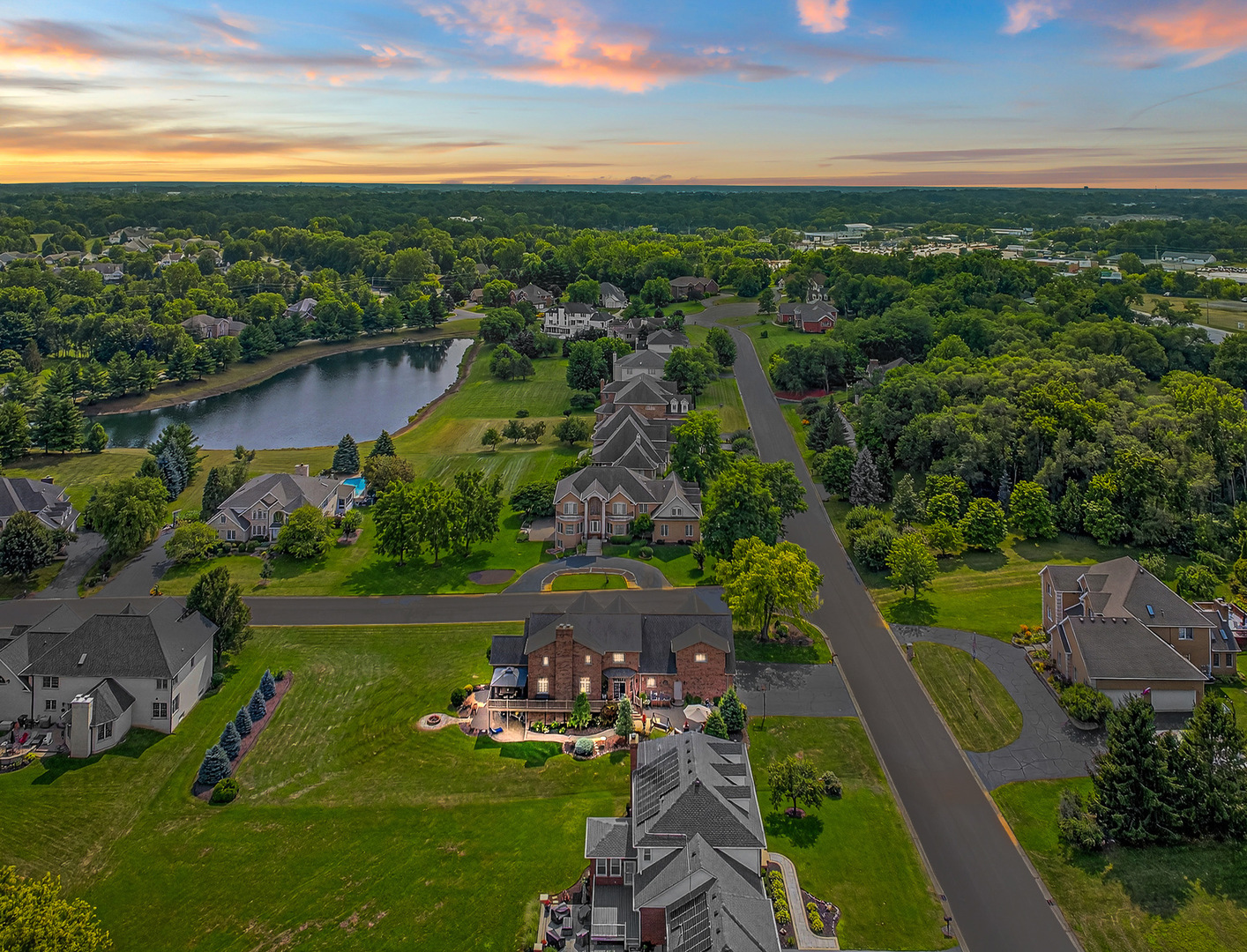 4210 Jacqueline Lane Crystal Lake, IL 60014 - Photo 44 of 48 an aerial view of a house with a garden and lake view