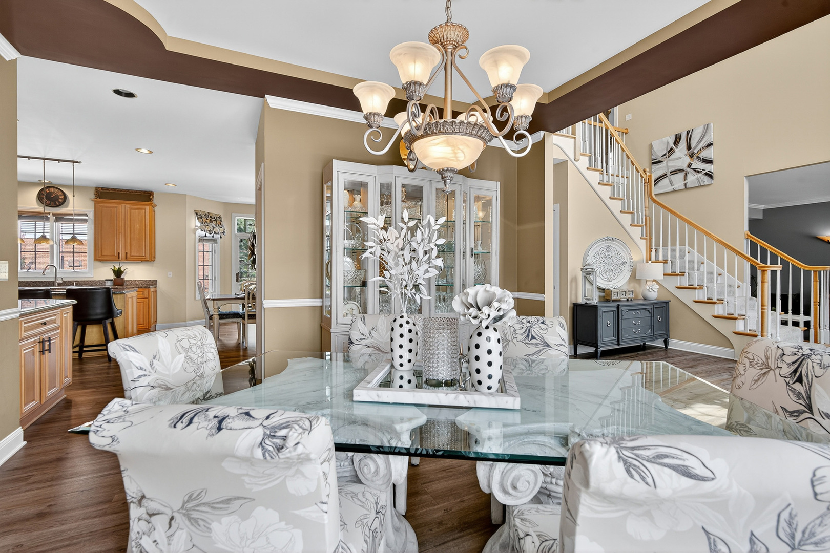 4210 Jacqueline Lane Crystal Lake, IL 60014 - Photo 7 of 48 a view of a dining room with furniture a chandelier and wooden floor