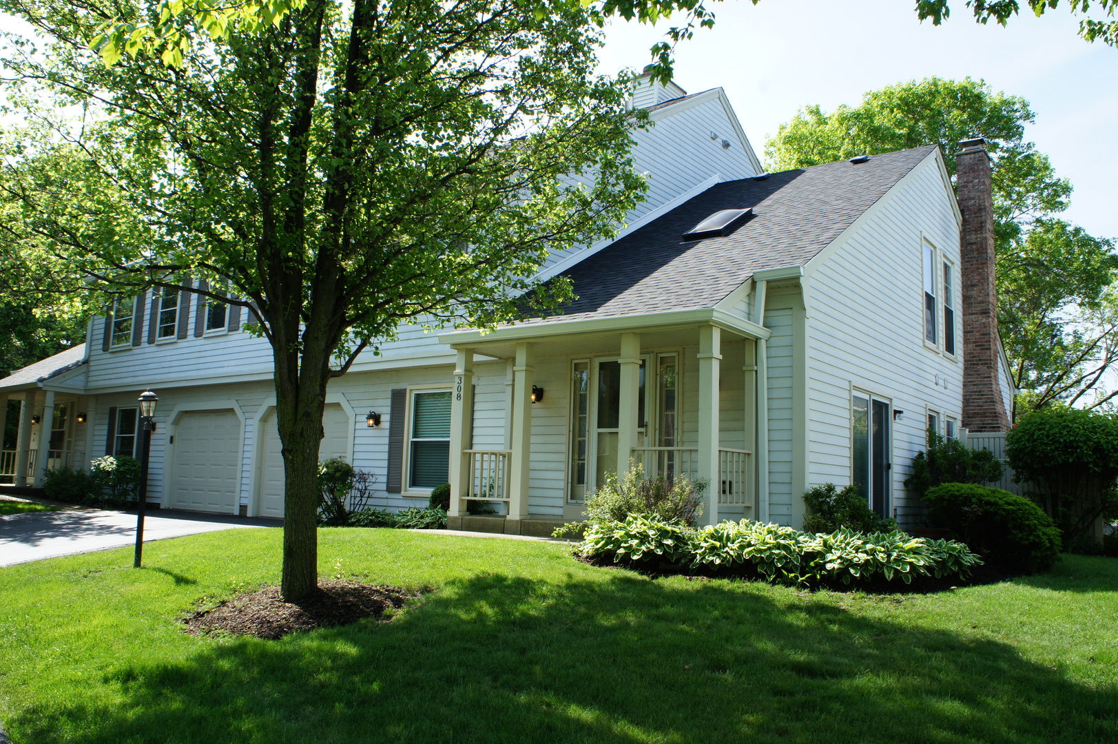 308 College Crossing, Unit 133 Rolling Meadows, IL 60008 - Photo 1 of 16 a house that is sitting in the grass