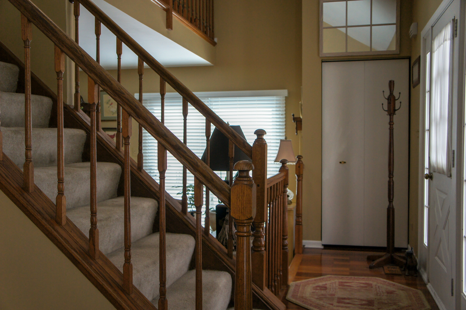 308 College Crossing, Unit 133 Rolling Meadows, IL 60008 - Photo 2 of 16 a view of an entryway with wooden floor and stairs