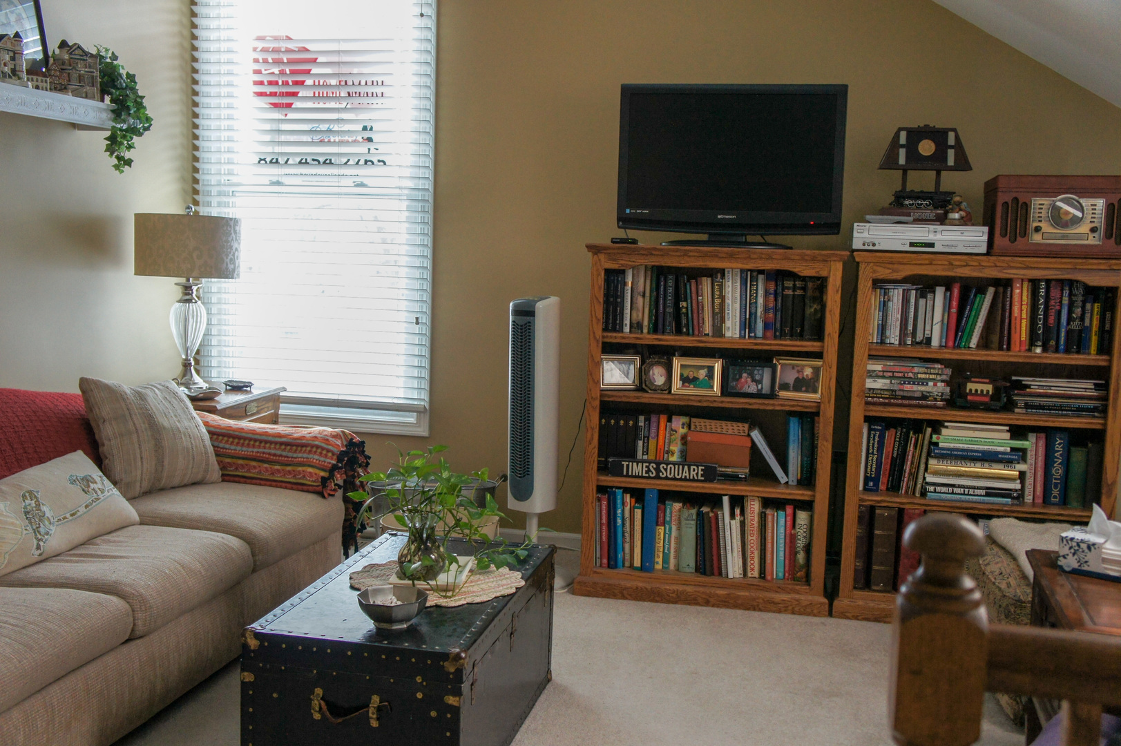 308 College Crossing, Unit 133 Rolling Meadows, IL 60008 - Photo 11 of 16 a living room with furniture and a flat screen tv