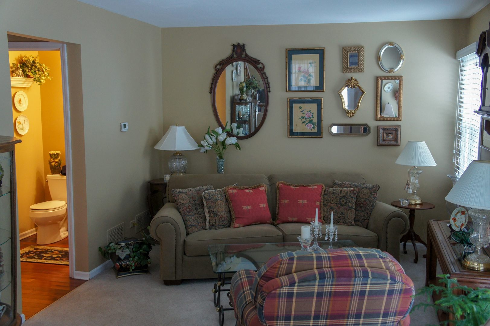 308 College Crossing, Unit 133 Rolling Meadows, IL 60008 - Photo 5 of 16 a living room with furniture a mirror and a window