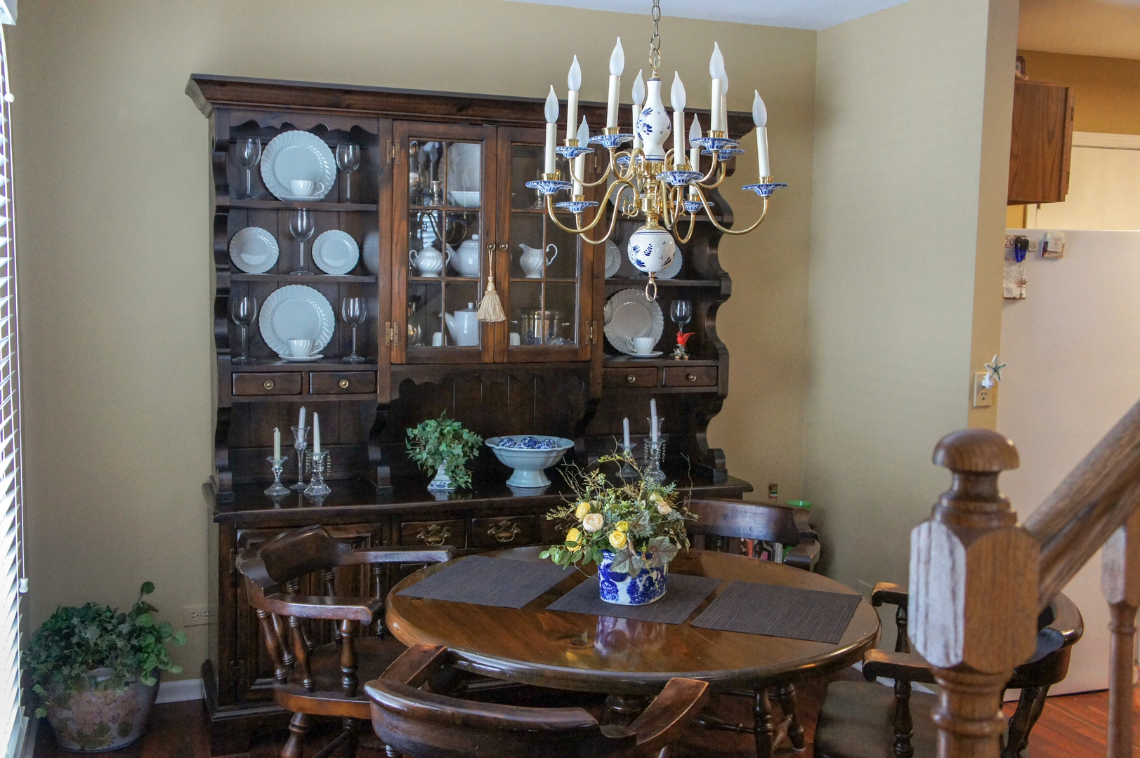 308 College Crossing, Unit 133 Rolling Meadows, IL 60008 - Photo 8 of 16 a view of a dining room with furniture and chandelier