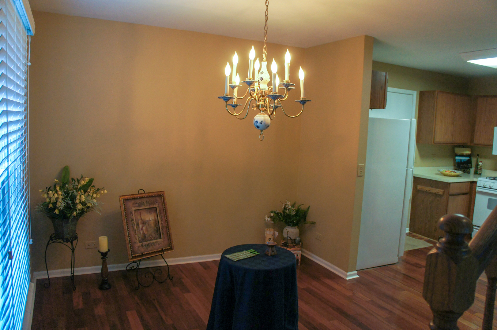 308 College Crossing, Unit 133 Rolling Meadows, IL 60008 - Photo 9 of 16 a room with painting on the wall and a wooden floor