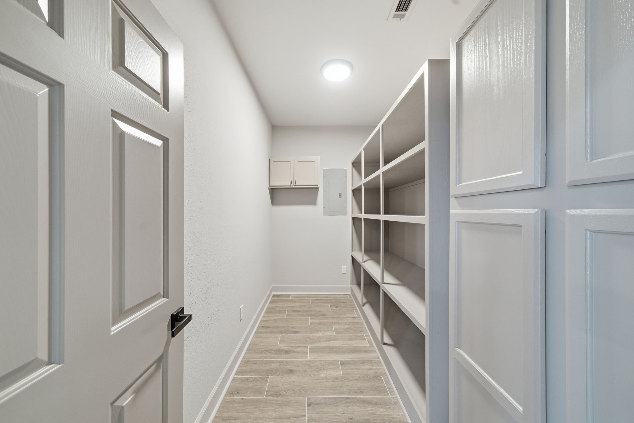 1918 Todville Road Seabrook, TX 77586 - Photo 16 of 41 Generous pantry and utility room is conveniently located just off the kitchen for easy storage and organization.