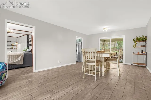 a view of a dining room with furniture window and wooden floor
