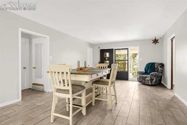 a dining room with furniture and window