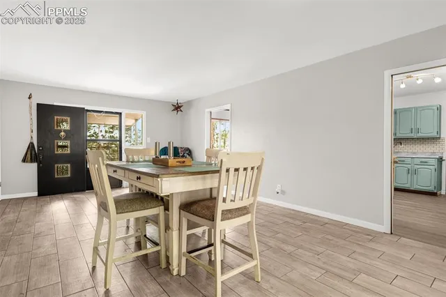 a kitchen with sink cabinets and wooden floor