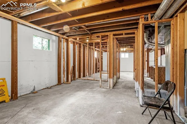 a view of a patio with table and chairs and wooden floor