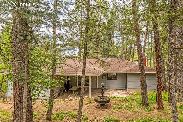 a view of a house with a tree