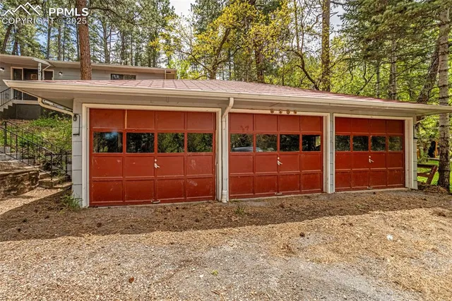 a view of a deck with table and chairs with wooden floor and fence